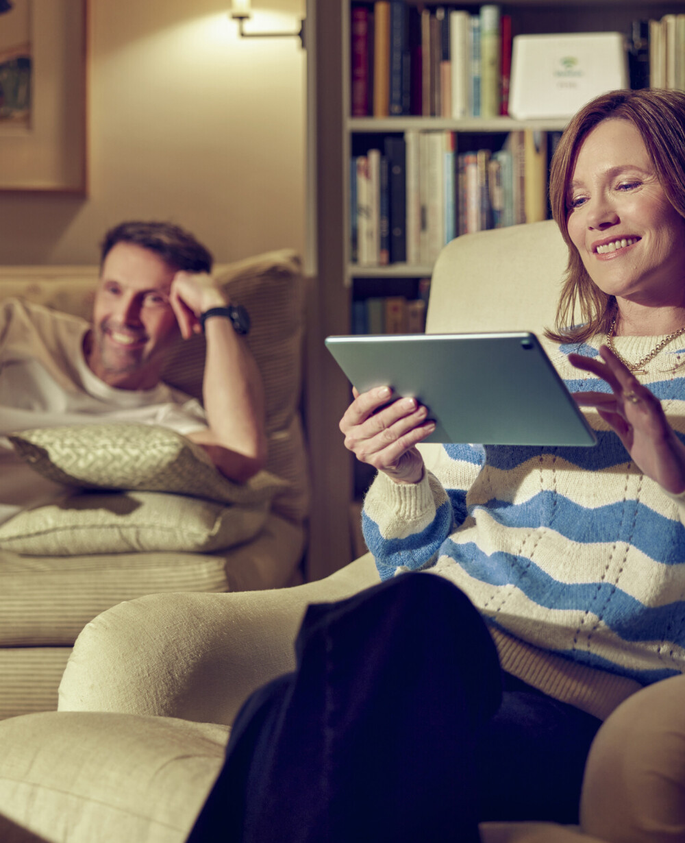 Happy couple streaming TV with ultra-fast broadband